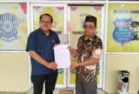 Kuasa hukum pelapor, Rahman, SH (kiri) bersama Klien nya Subandrio