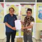 Kuasa hukum pelapor, Rahman, SH (kiri) bersama Klien nya Subandrio 