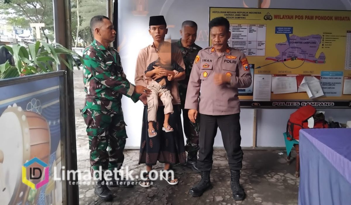 Pos Pengamanan Polres Sampang Berhasil Pertemukan Bocah dengan Keluarganya Saat Liburan di Pantai Camplong